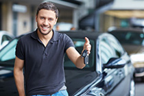 A man holding car keys